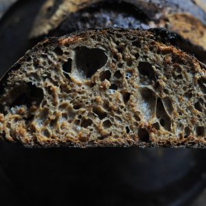 malted flour sourdough loaf cut in half