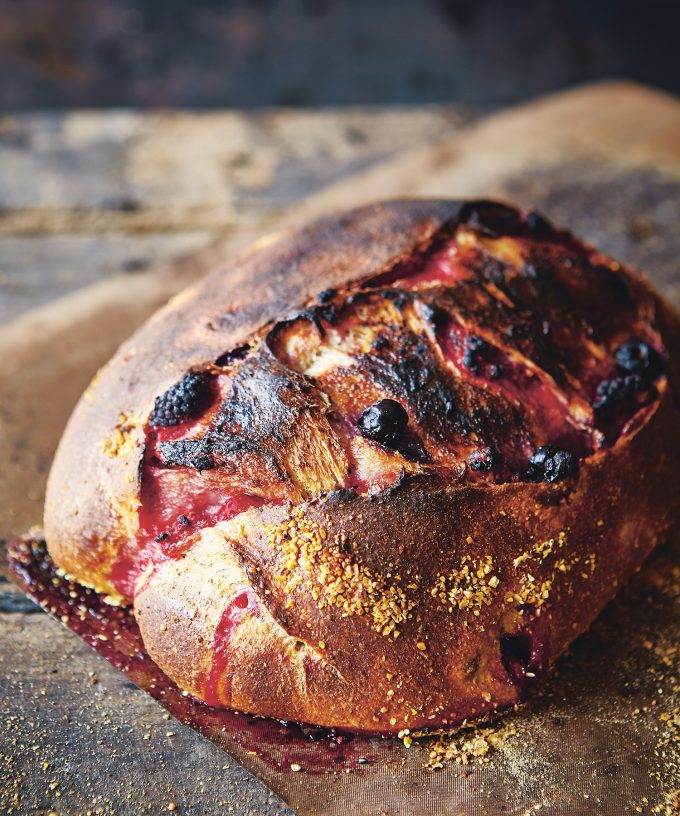 Artisanal whole grain sourdough bread with antioxidant-rich berries, representing neuroprotective nutrition and brain health research at The Sourdough School.