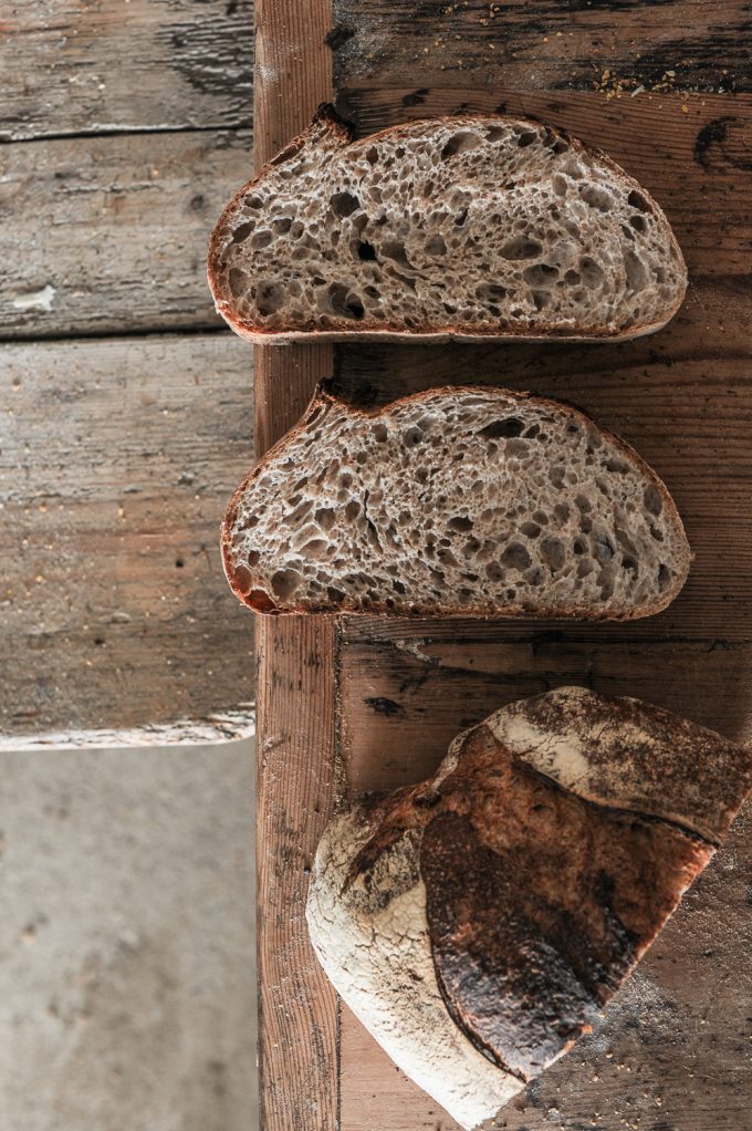 50% wholegrain sourdough. Whole-grain sourdough bread representing research-informed baking for digestive health and allergy awareness.
