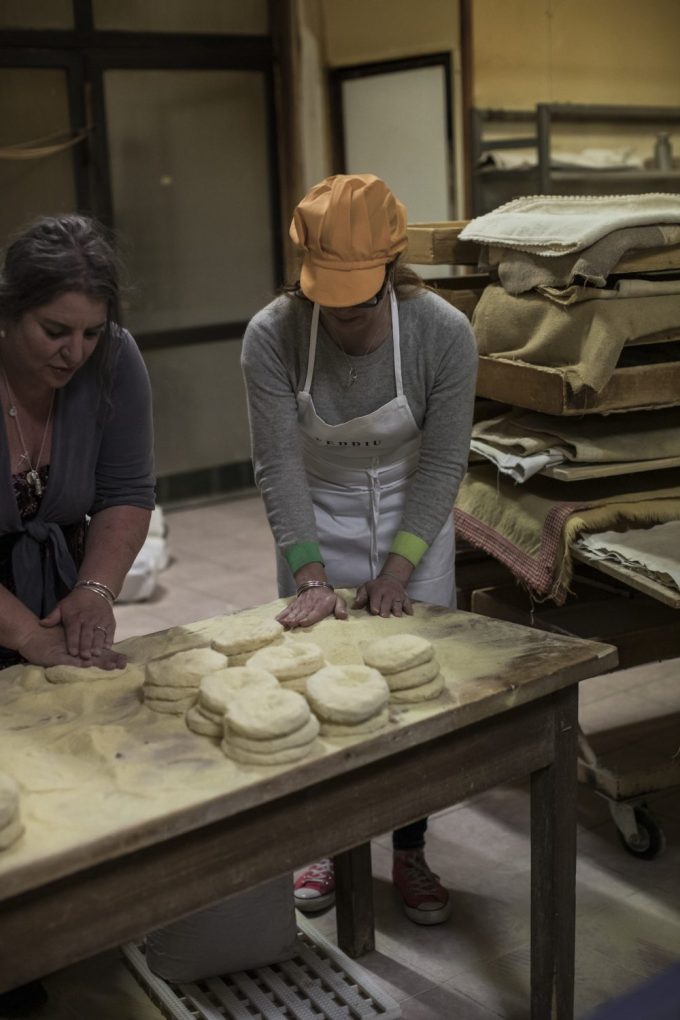 working on a bakery in the blue zone Vanesa and Alex making bread and 3am in the morning in Sardinia in the bakery 