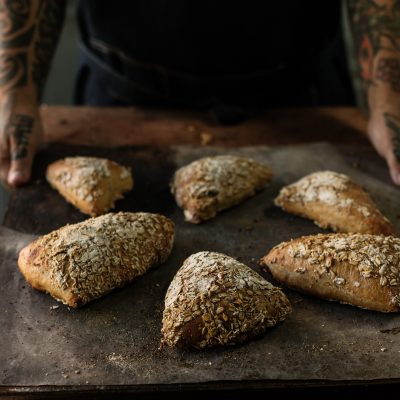 A batch of Oats Pocket Bread from 10-Minute Sourdough by Vanessa Kimbell, showcasing a high-fibre sourdough bake designed to support healthy cholesterol levels through the BALM protocol.