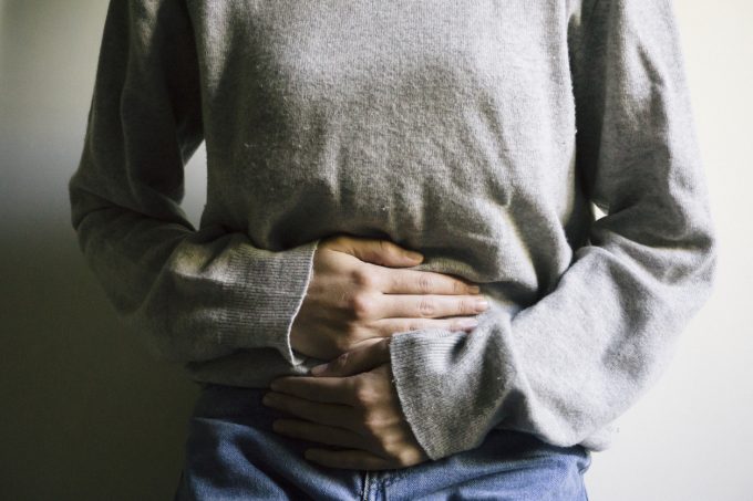 Woman suffering with stomach ache