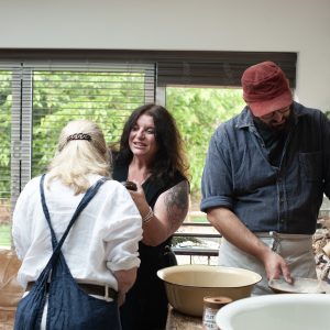 VANESSA WITH STUDENTS MILLING FLOUR
